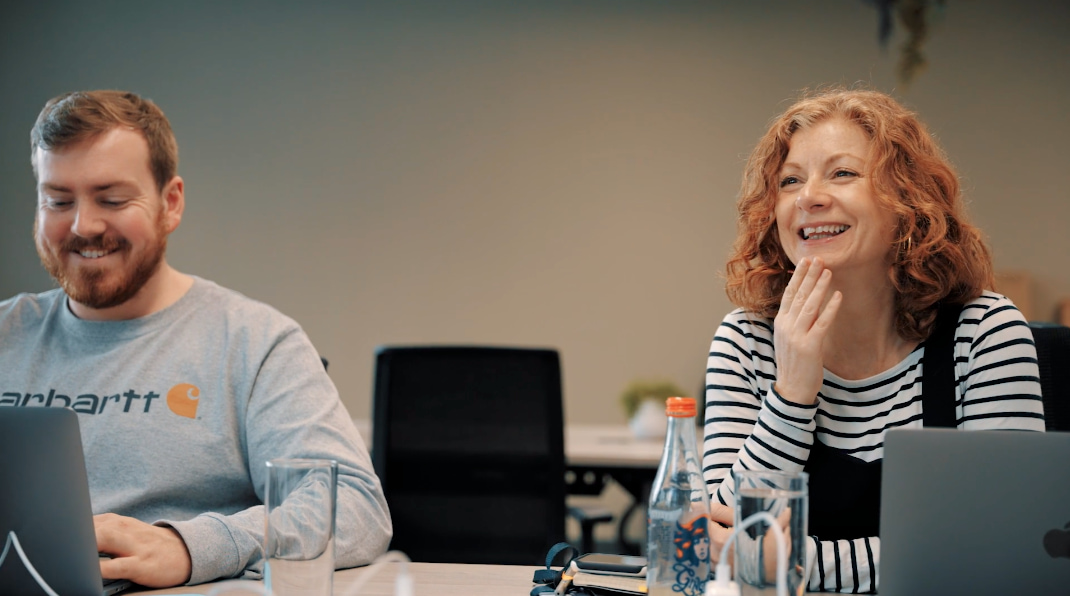 Adam and Amy working in office